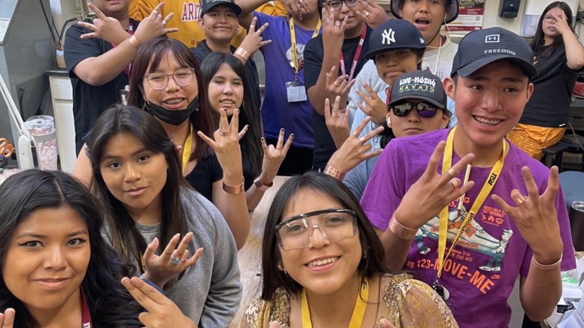 INSPIRE participants show their Sun Devil pride with the pitchfork hand sign.