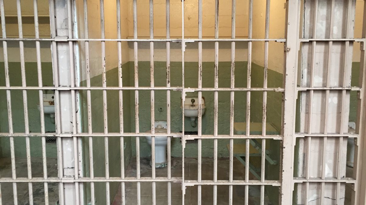 A jail cell stands empty.