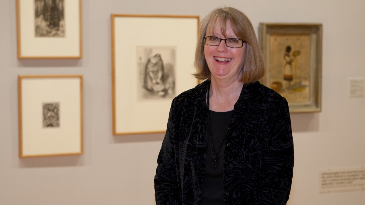 ASU Art Museum Curator of Prints Jean Makin poses in a gallery