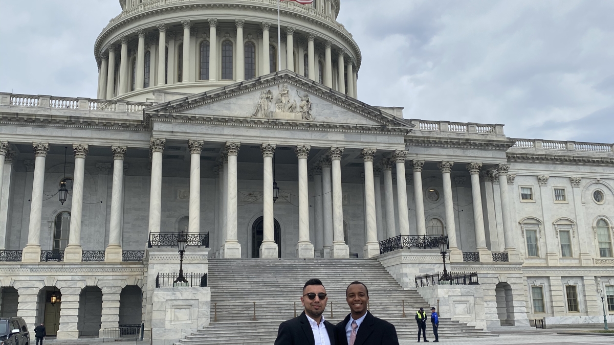 Alex Butler and Joaquin Ramos in front of the U.S. Capitol building