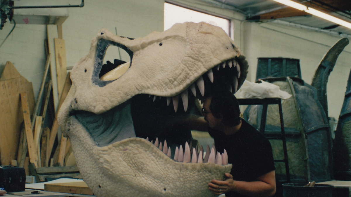 Special effects artist Michael Trcic works on a T. rex