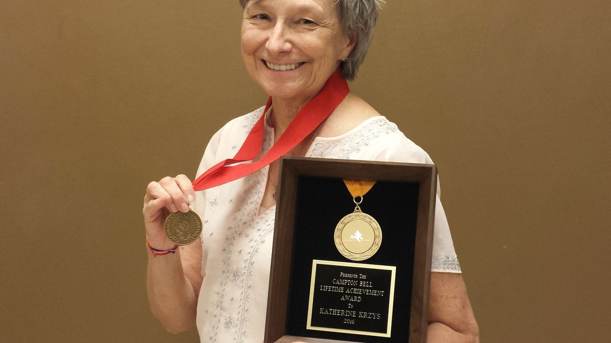ASU Libraries archivist Katherine Krzys with her Childrens Theatre Foundation of America Corey Medallion and the Campton Bell Lifetime Achievement Award 