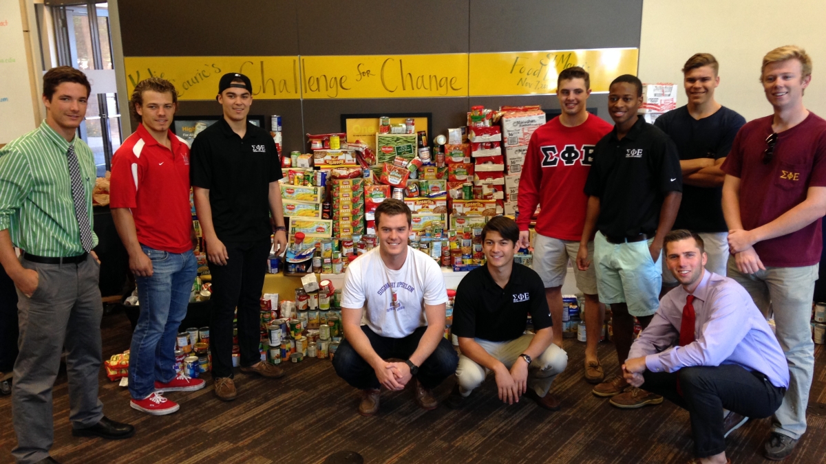 group of students with food donations
