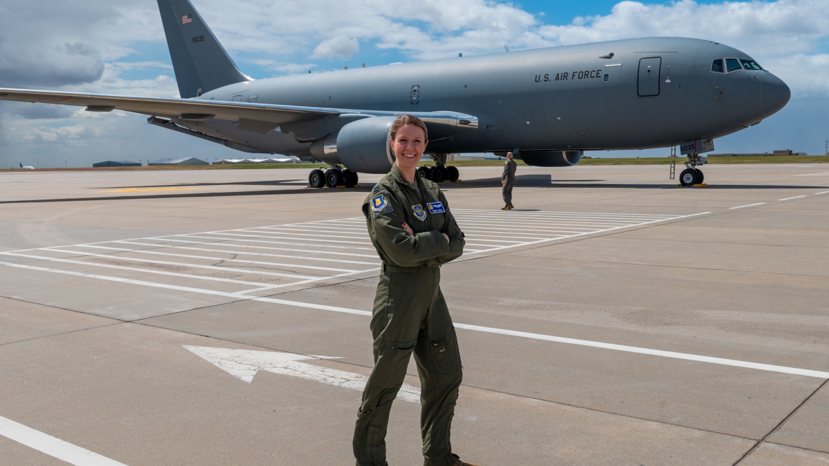 Courtesy photo of ASU graduate Kimberly Jackson in Air Force uniform with a KC-46 in the background.