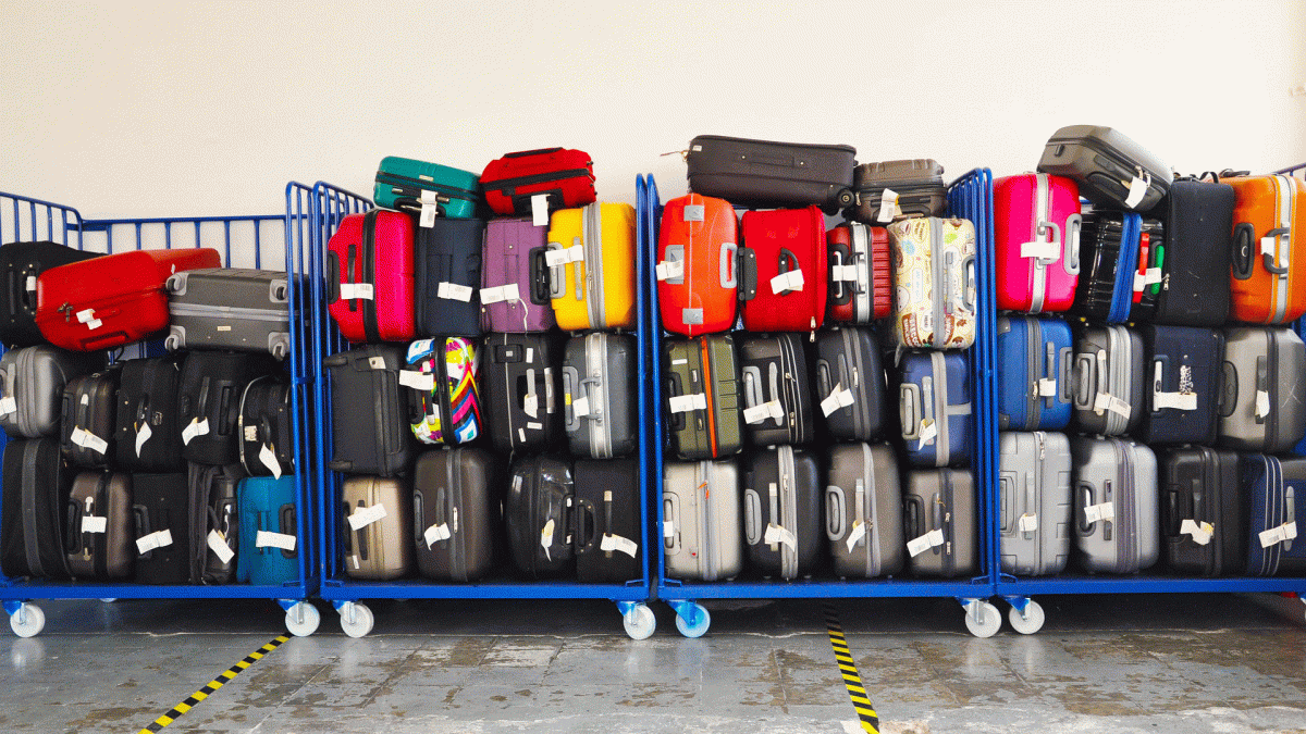Baggage sits on racks at an airport