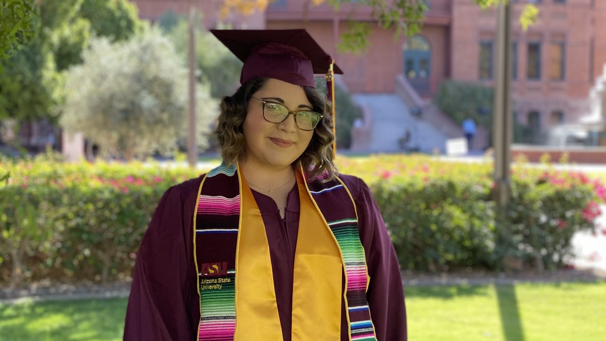 Marlene Ortega ASU grad in her cap and gown and Hispanic Convocation stole