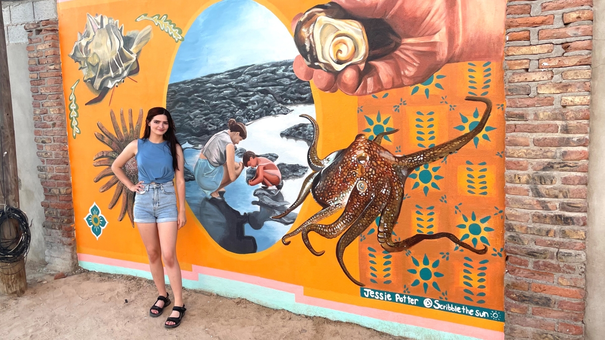 ASU student Jessica Potter with her tidal pool mural in Mexico