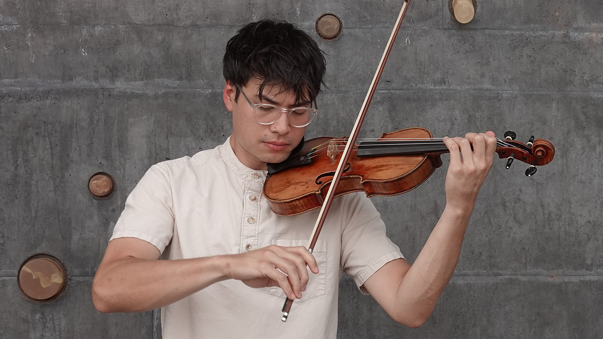 Julian Tuan Anh Nguyen playing violin.