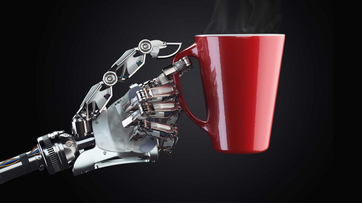 A robotic hand holds a steaming mug of coffee