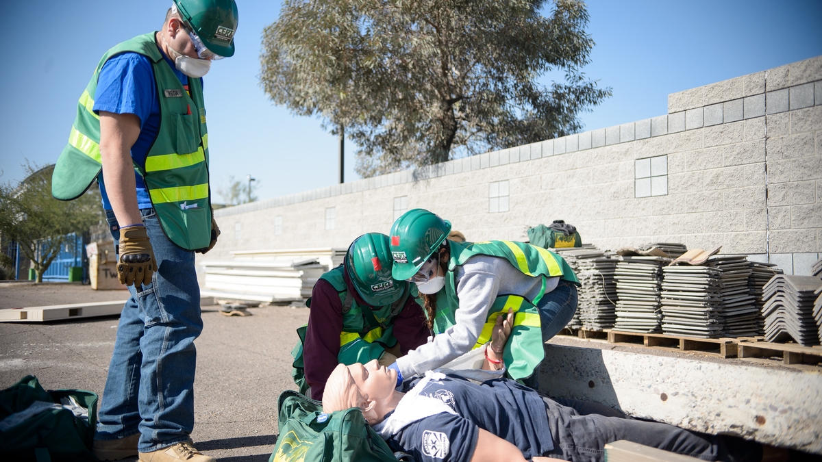 ROTC CERT trainees rescuing a dummy from underneath a block of cement