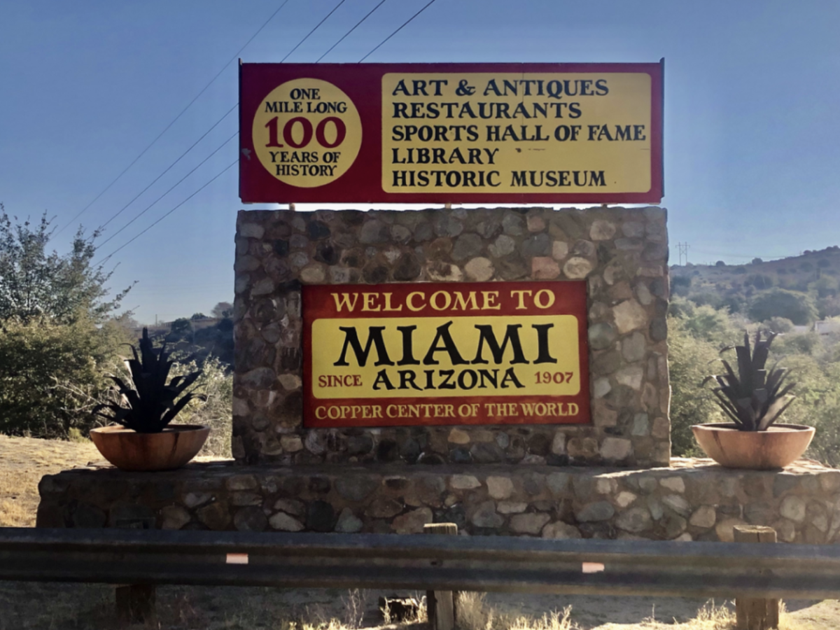 Image of the Miami, Arizona welcome sign. Stating "one mile long, 100 years of history" 