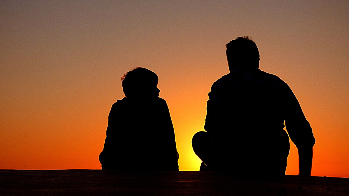 parent and child in silhouette
