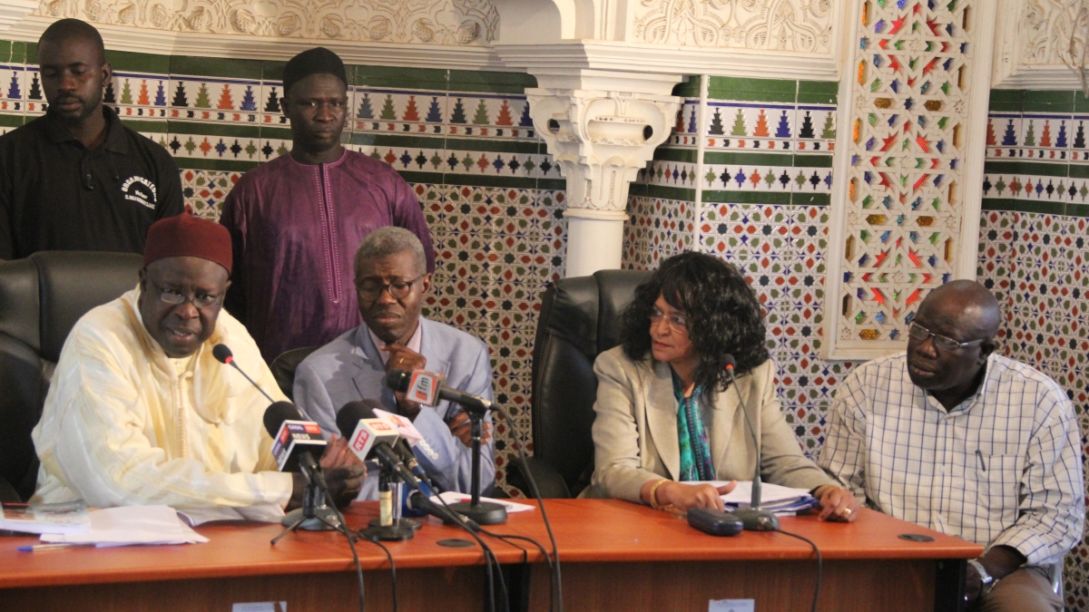 Photo of Souad Ali on panel with Senegalese leaders
