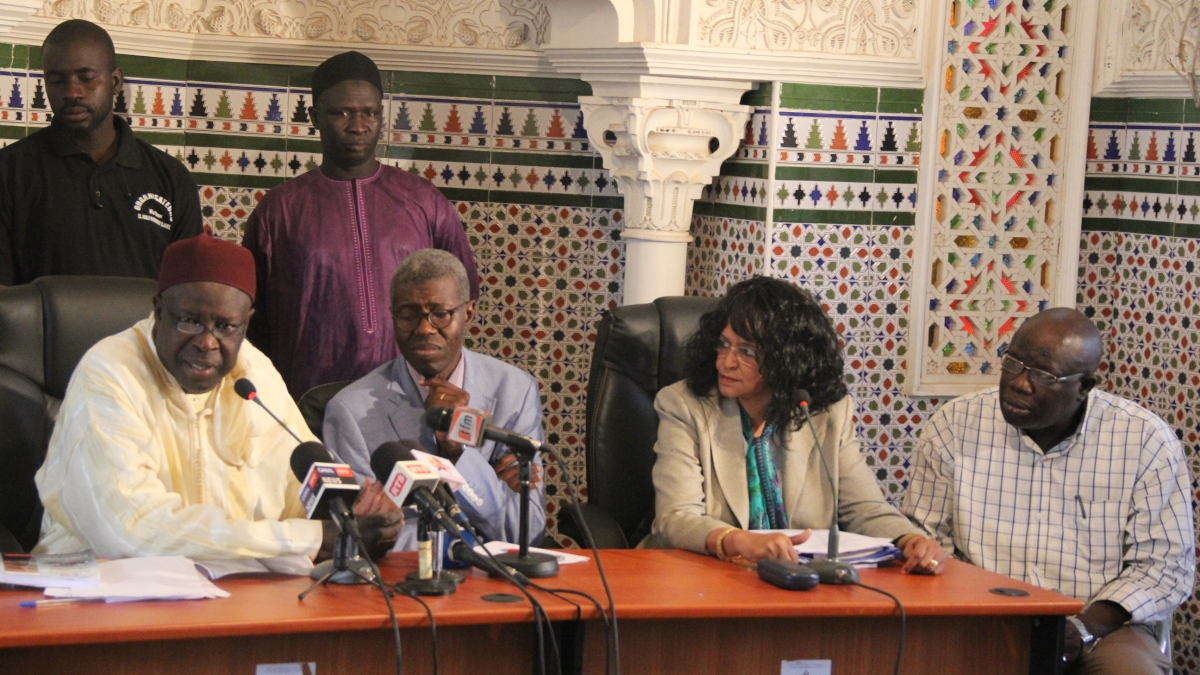 Photo of Souad Ali on panel with Senegalese leaders