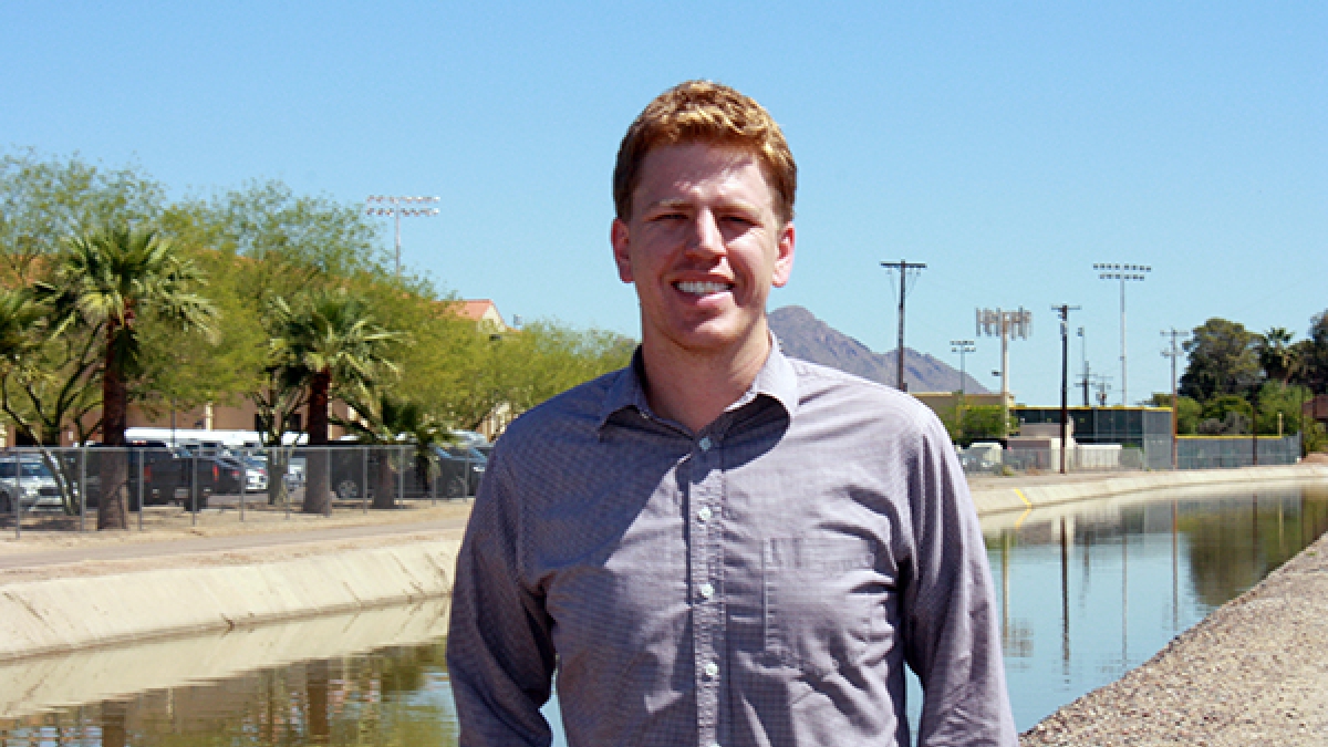 ASU student standing in front of a Phoenix canal