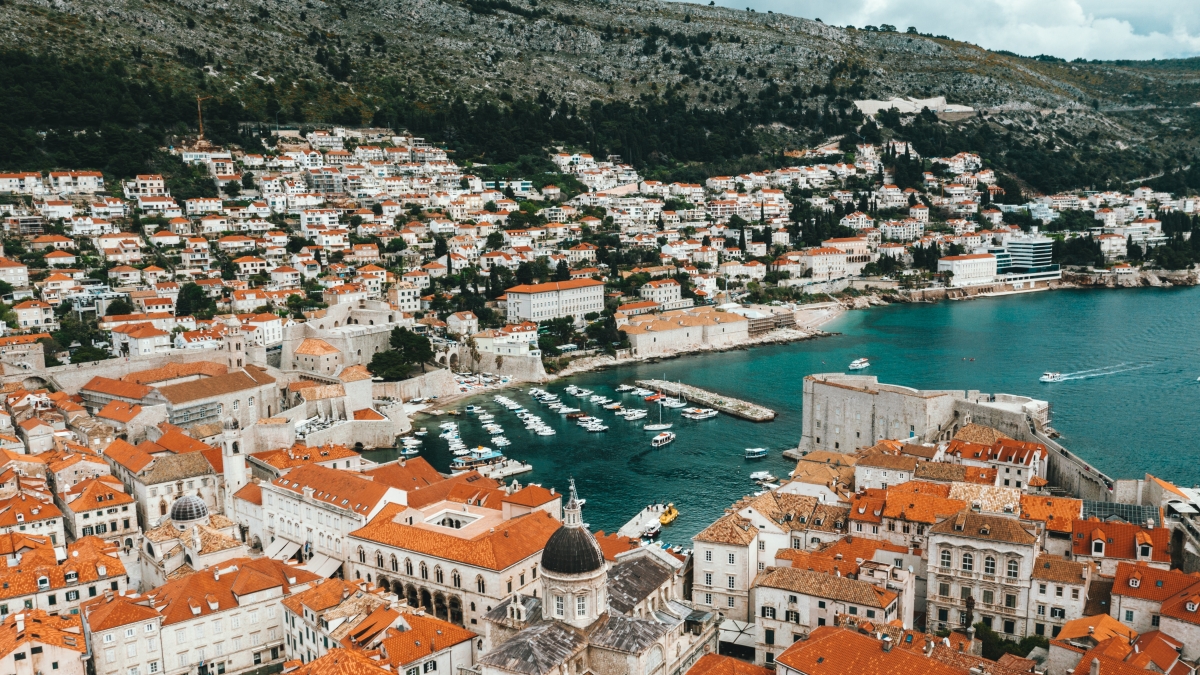 aerial view of Dubrovnik, Croatia showing the roofs of houses next to the sea