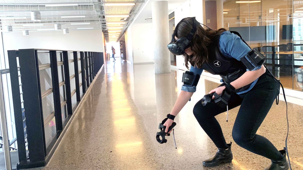 Construction management doctoral student Kieren McCord can be seen wearing virtual reality and haptic devices that Associate Professor Steven Ayer utilizes in his Arizona State University classroom to teach students visualization and job safety skills.