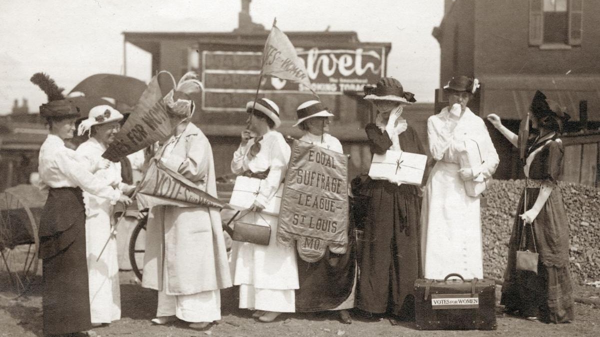 Archived photo of group of women traveling promoting women's suffrage rights.