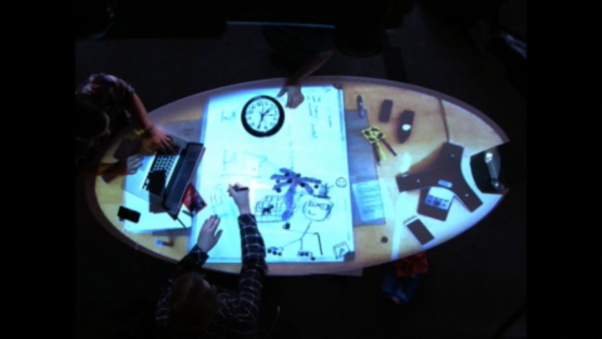 Tabletop overhead view of interactive projection on table