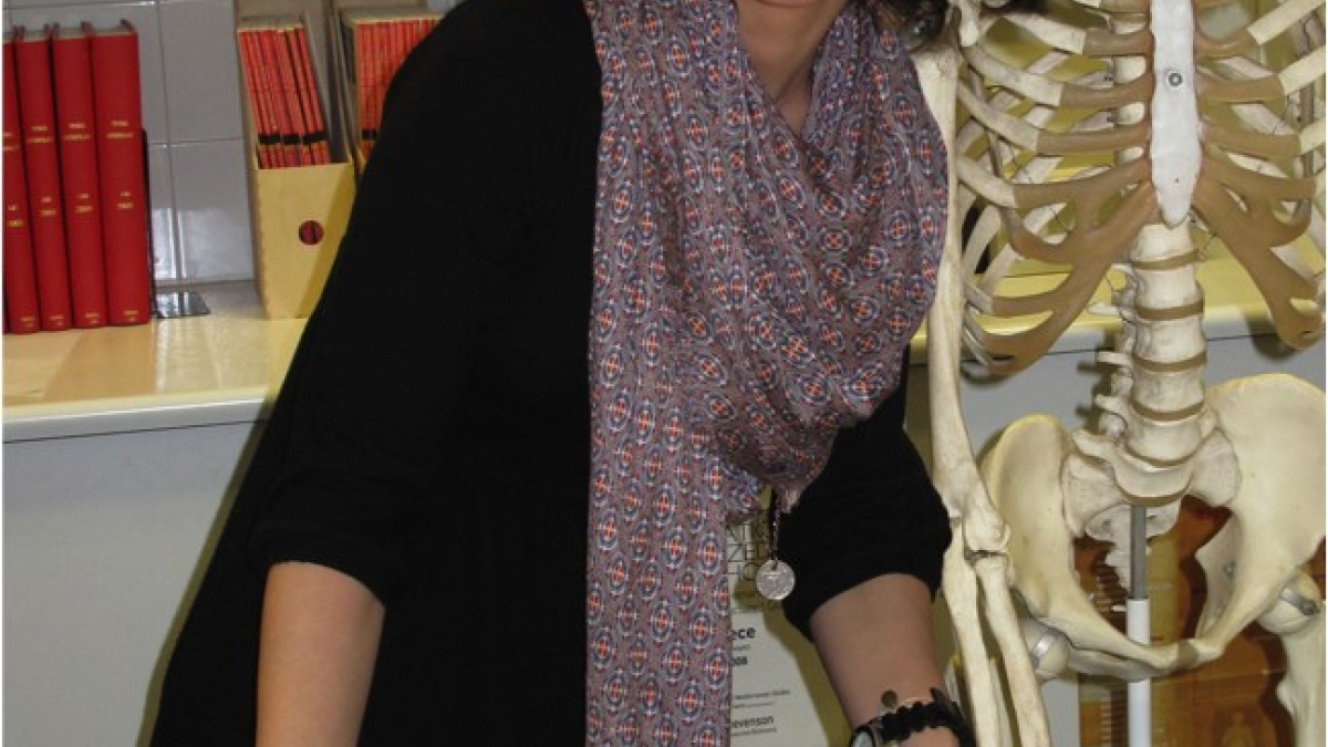ASU bioarchaeology student showing ancient teeth