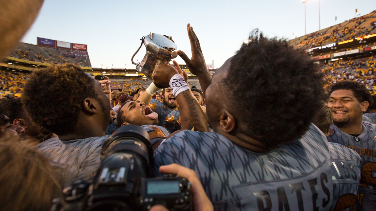 ASU football players holding up Territorial Cup