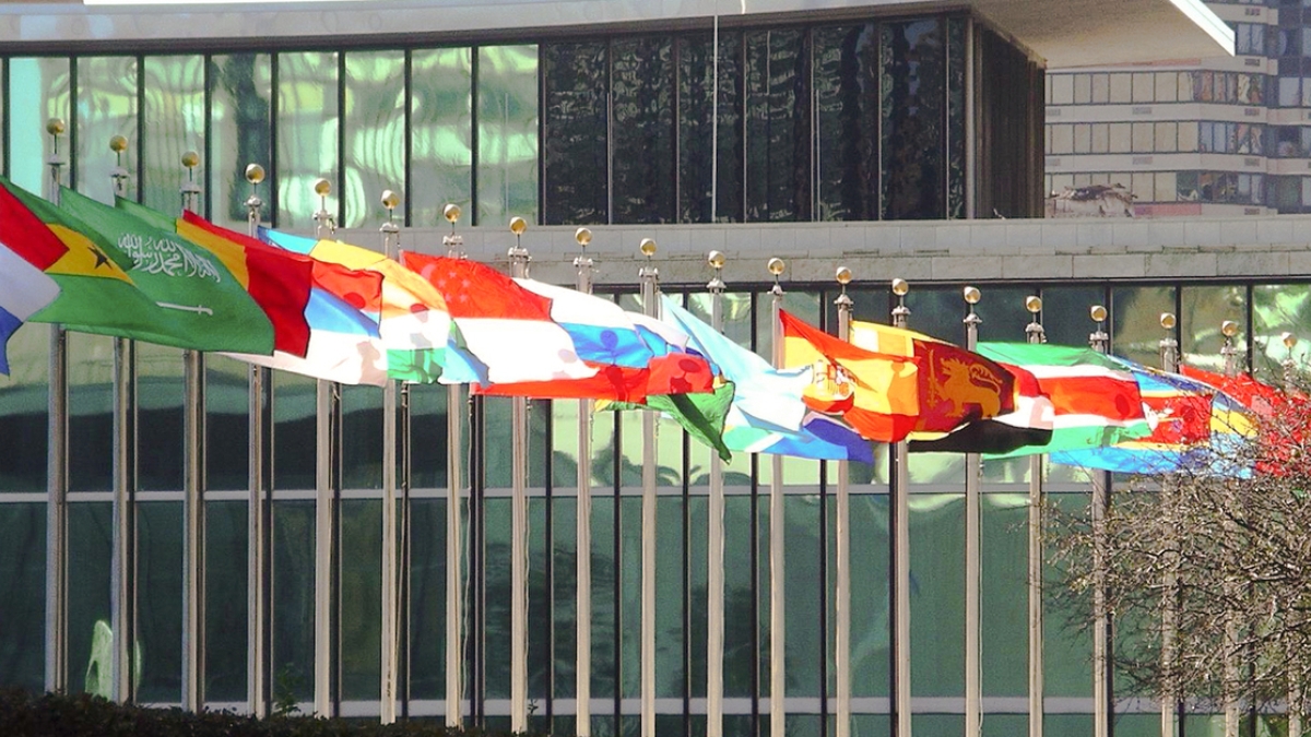 A photograph of international flags at the United Nations