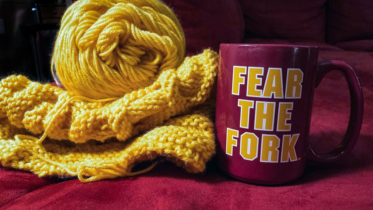 gold yarn and mug that says "Fear the Fork"