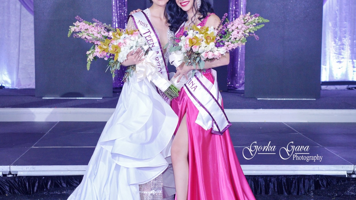 Yulissa Felix, right, was named the winner of the Miss Arizona Latina competition last month. Felix wears a floor-lenght hot pink gown with a slit up the leg. She is holding flowers and wearing a crown. Next to her is the teen pageant winner, in white.