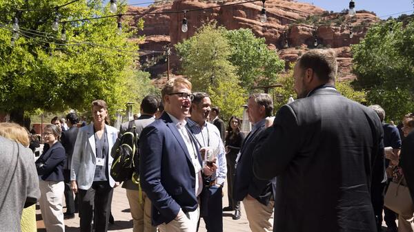 People mingling outside at event in Sedona