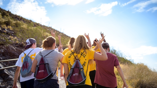 Students walking on a trail