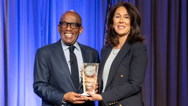 Al Roker and ASU provost Nancy Gonzales holding Cronkite award