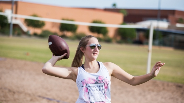 Woman throwing football