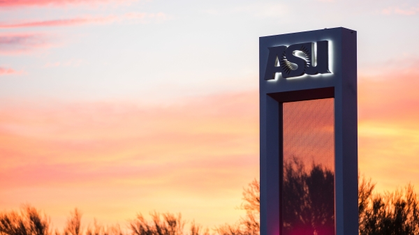 concrete pillar with ASU logo silhouetted by an Arizona sunset