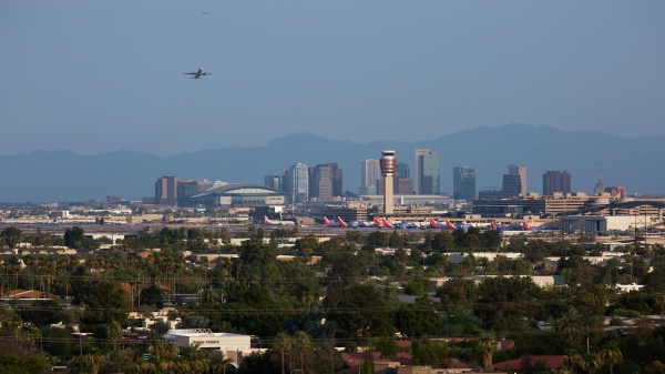 A view of the Phoenix downtown skyline as a plane takes off