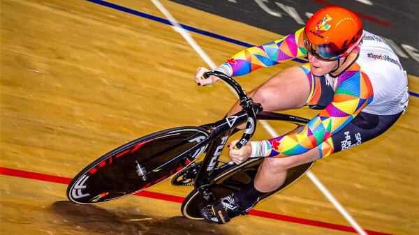 Bicyclist racing around the track