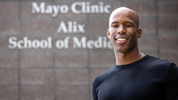 Portrait of student in front of Mayo Clinic Alix School of Medicine