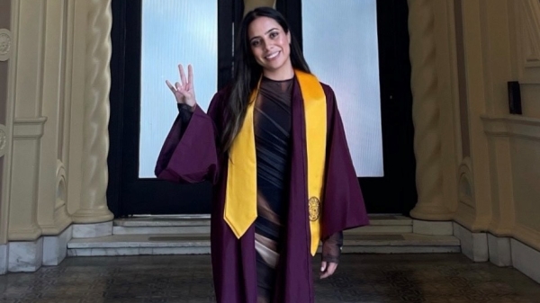 ASU Local grad Kiana Tovar poses in graduation cap and gown