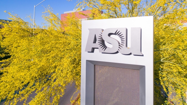 ASU sign with Palo Verde tree in bloom behind it