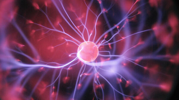 Image of brain receptors, neurons firing up in colors of pink and purple.
