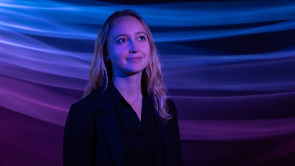 Portrait of a woman with purple and blue light background