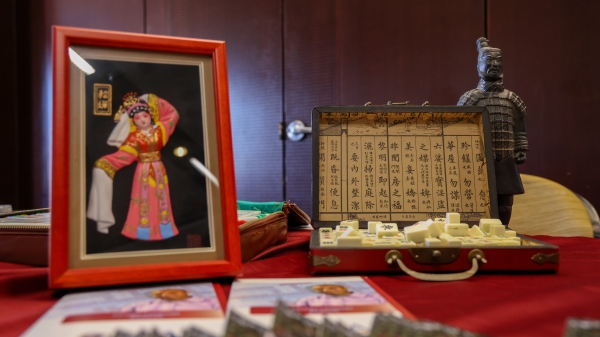 Chinese display at International fair showing various cultural items.