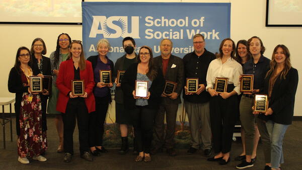 Recipients of 2024 Social Work Month Awards pose for a group photo.