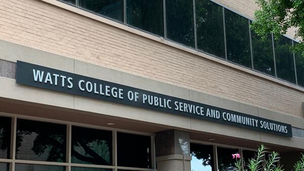 Exterior of a building with a sign that reads "Watts College of Public Service and Community Solutions."