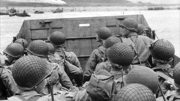 Black-and-white photo of soldiers in a boat on D-Day.