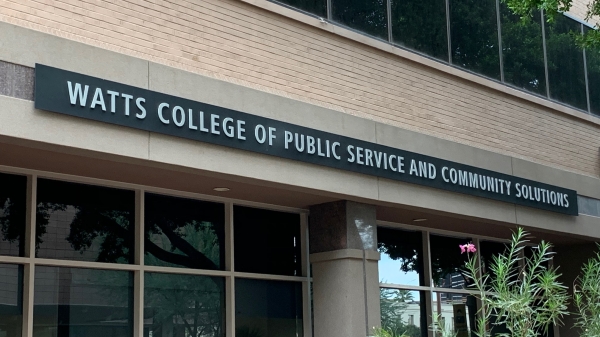 Exterior of a building with a sign reading, "Watts College of Public Service and Community Solutions."