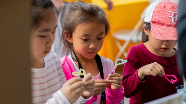 Female children creating a craft at ASU Open Door, Tempe