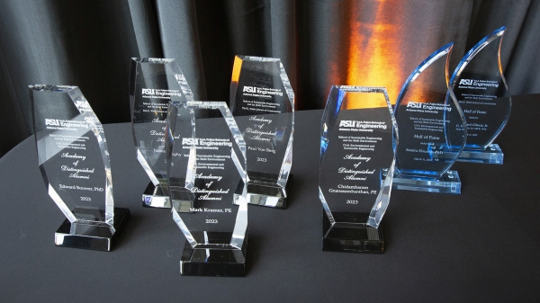 A photo of several awards on a table.