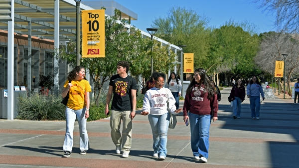 Students walk together across the West Valley campus. 