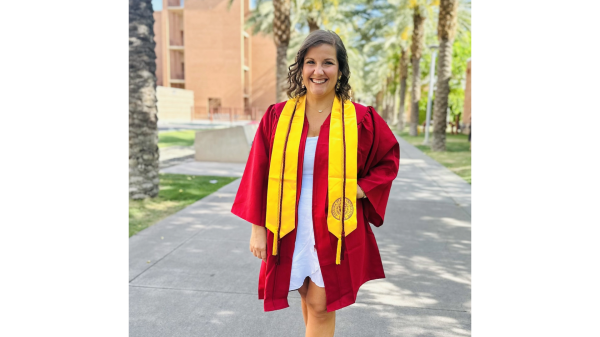 Brook Schumacher in graduation regalia on the Tempe campus