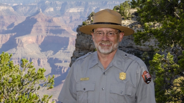 Grand Canyon National Park Superintendent Ed Keable standing in front of the canyon. 